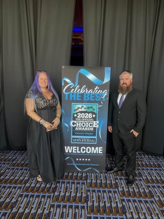 The owners of Cuts on the Coast at the 2026 Volusia&ndash;Flagler Community's Choice Awards