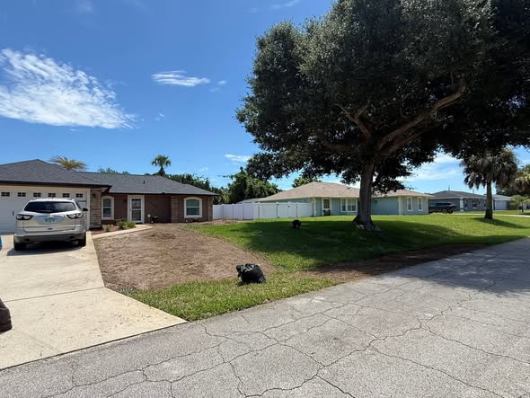 Front yard curb appeal cleanup with trimmed grass and clean edges