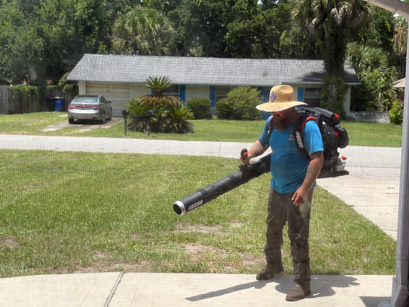 Cuts on the Coast owner blowing off a driveway after a cut